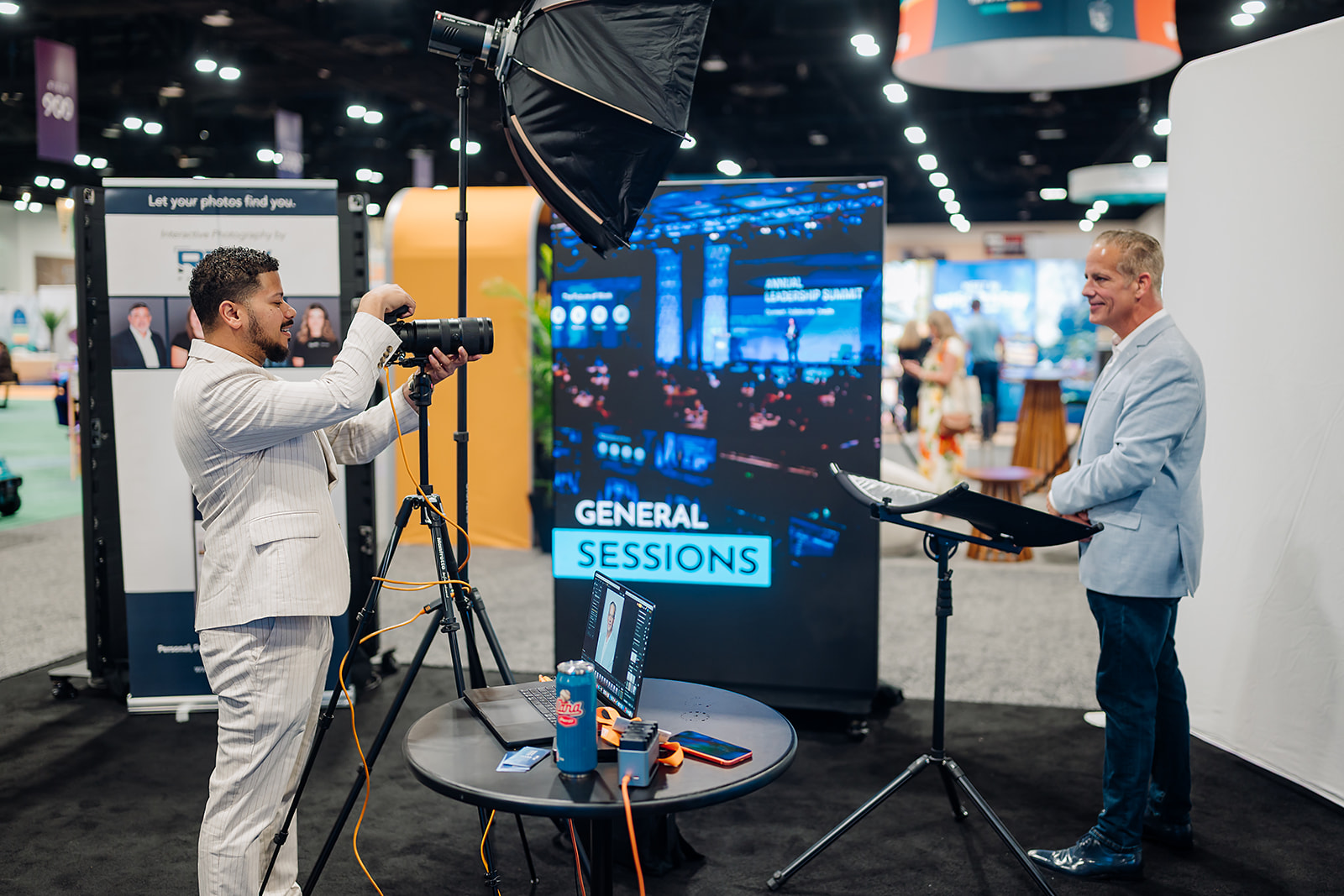 Conference attendee being photographed at a branded event headshot lounge