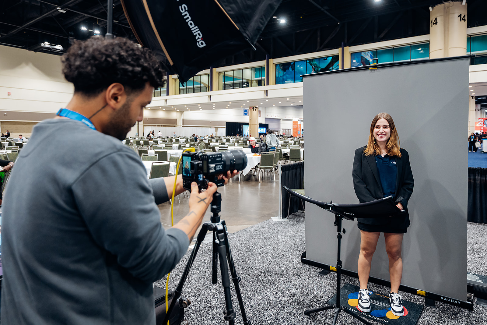 Photographer capturing a professional headshot at an RTW headshot lounge activation