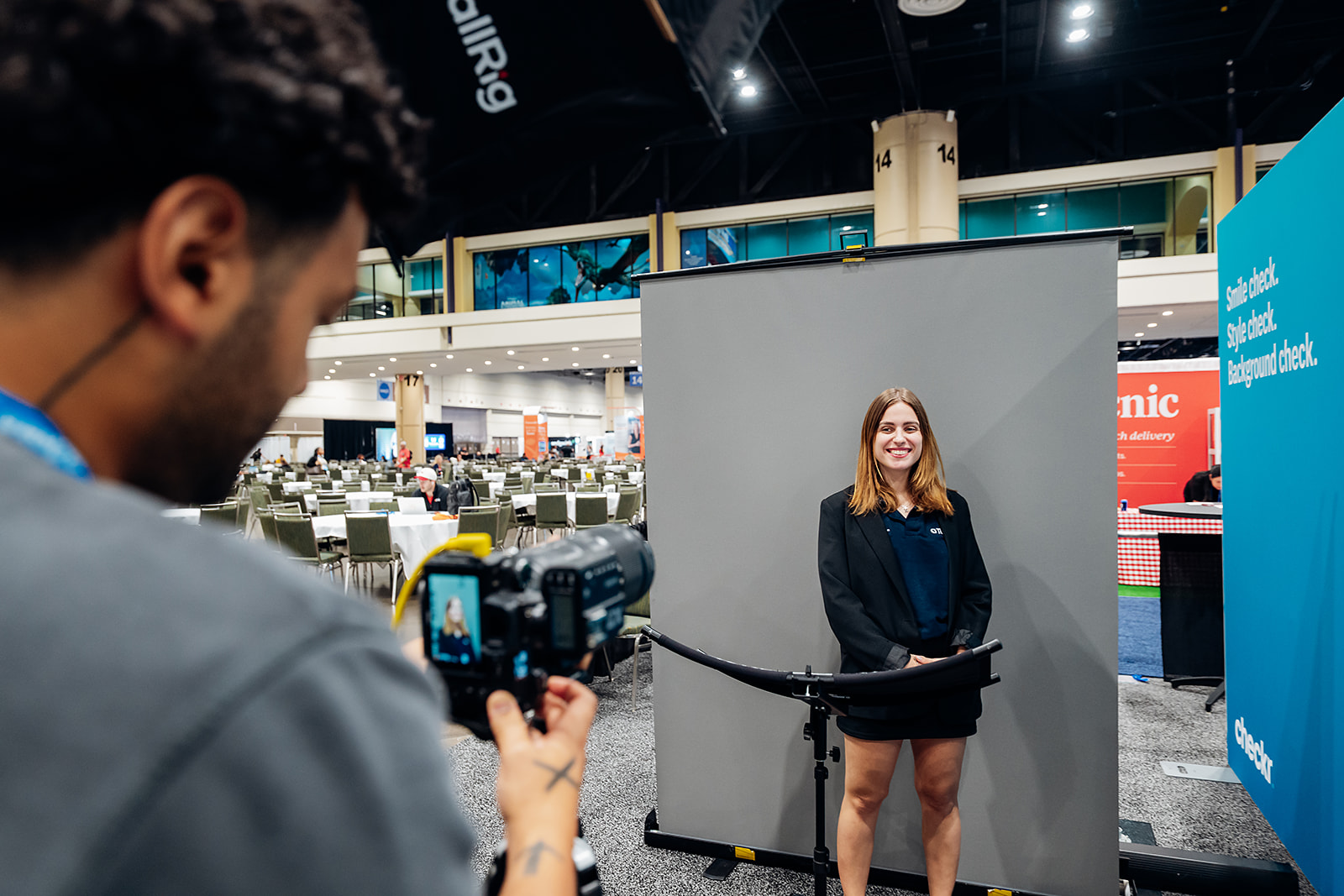 Attendee posing for a professional headshot at the RTW event lounge